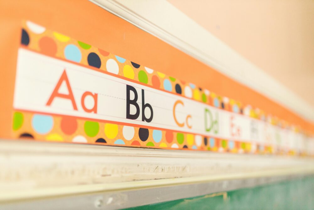 Alphabet poster above the chalkboard in a classroom. (Photo by RDNE Stock project via Pexels)