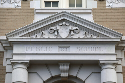 Façade of a New York City Public School. (Photo by Halytskyi Olexandr, Adobe Stock)
