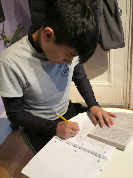 Hector working on homework