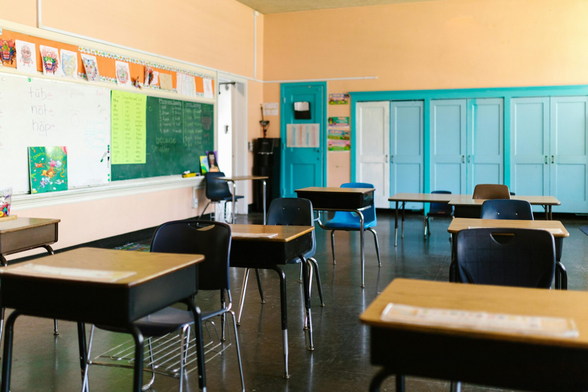 An empty classroom with desks six feet apart. (Photo by RDNE Stock project via Pexels)