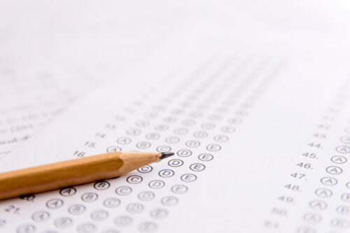 Pencil on a standardized test answer sheet. (Photo by Achira22, Adobe Stock)
