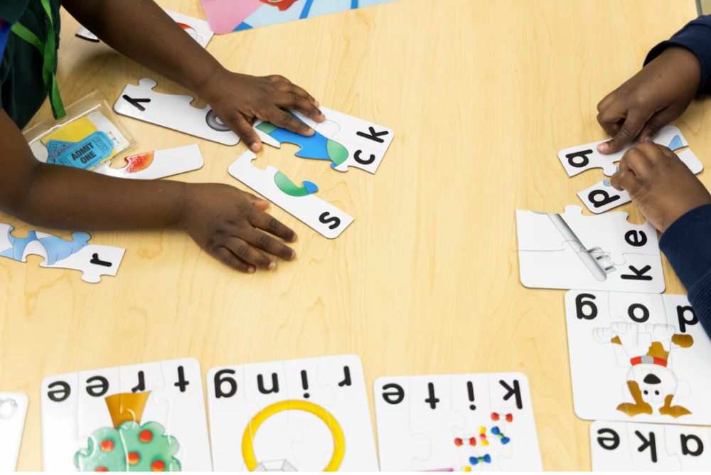 Pre-K students work on a puzzle. A new report found that 9,800 preschool children with disabilities did not receive all of their required services last school year.