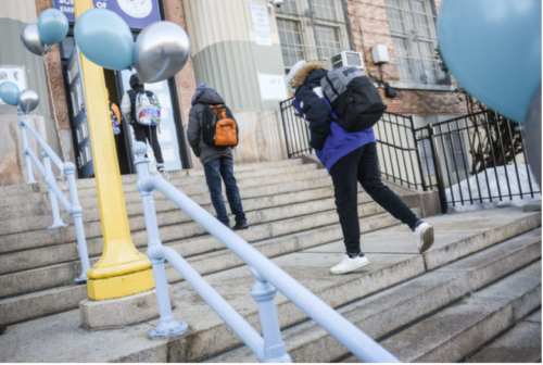 Students head into school in New York City in February 2021.