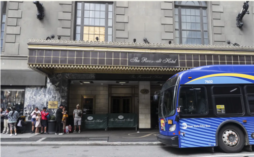Image of bus in front of the Roosevelt Hotel.