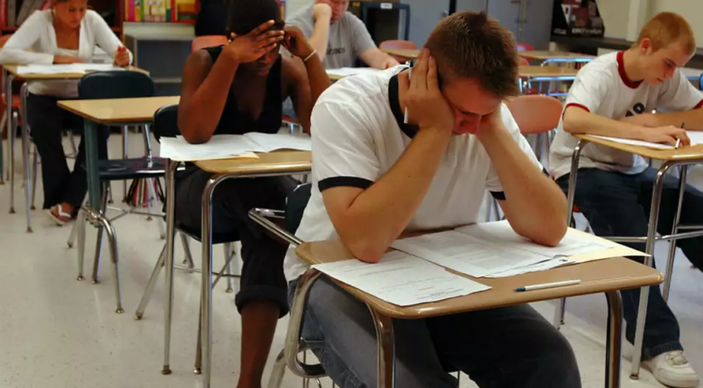 Students concentrate on a Regents exam at Ravena-Coeymans-Selkirk High School. A study of thousands of exam outcomes by a congolmerate of advocacy groups said Regents exam results do not prove how much a student has learned.