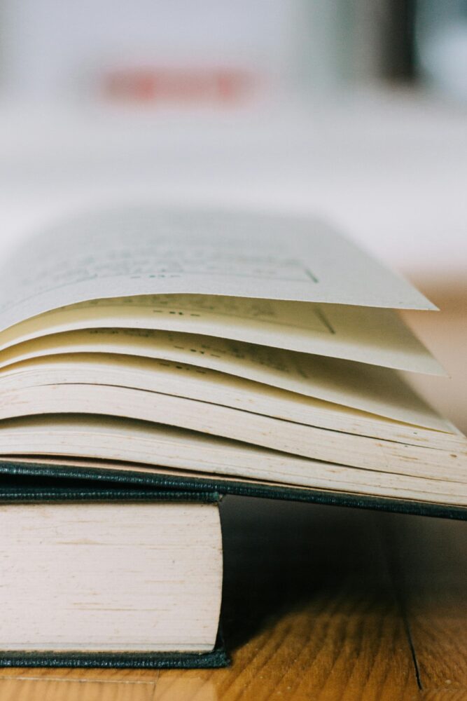 Close-up of an open book. (Photo by Bilakis via Pexels)
