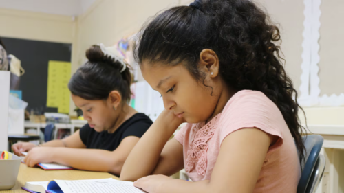 Third graders at P.S. 125 participate in a reading lesson. A new report focuses on parent perceptions of how well their schools are communicating about reading instruction.