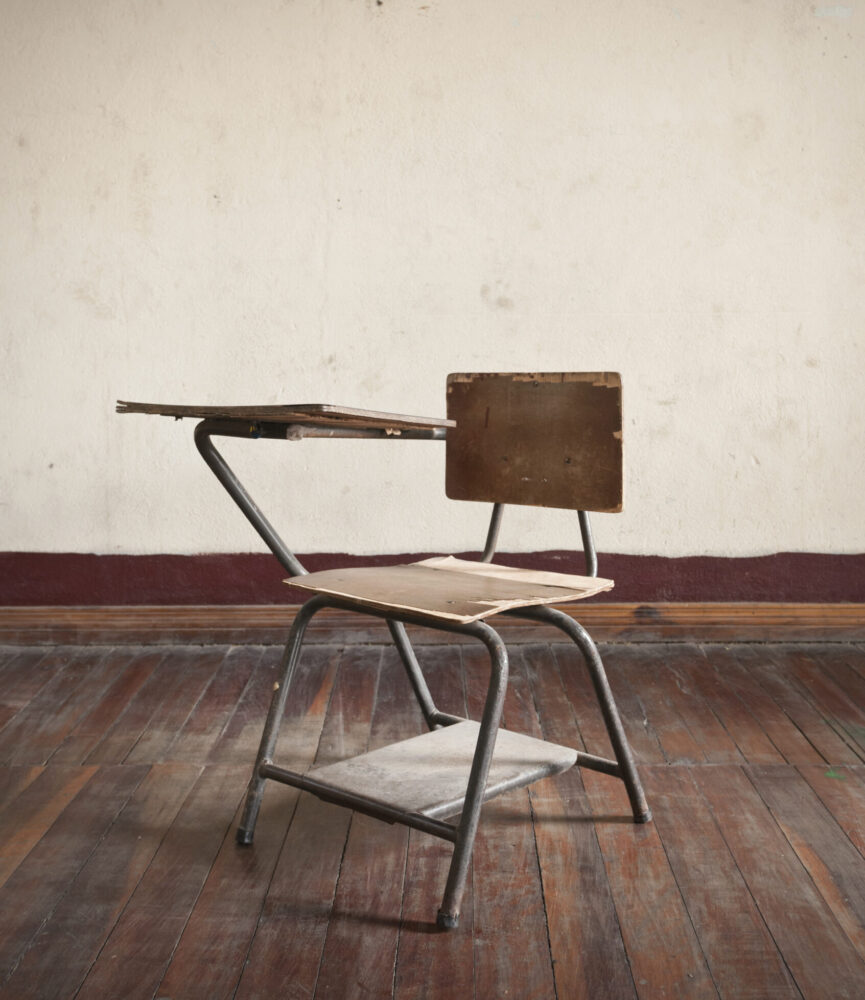 An empty school desk.