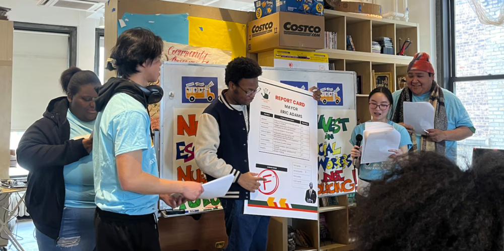 Students present their budget priorities regarding school safety and restorative justice at a 