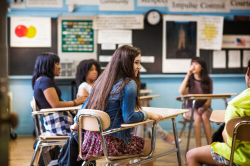 High school students sitting in a classroom. (Photo by Cavan for Adobe, Adobe Stock)