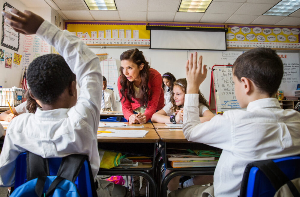 Teacher teaching students in classroom