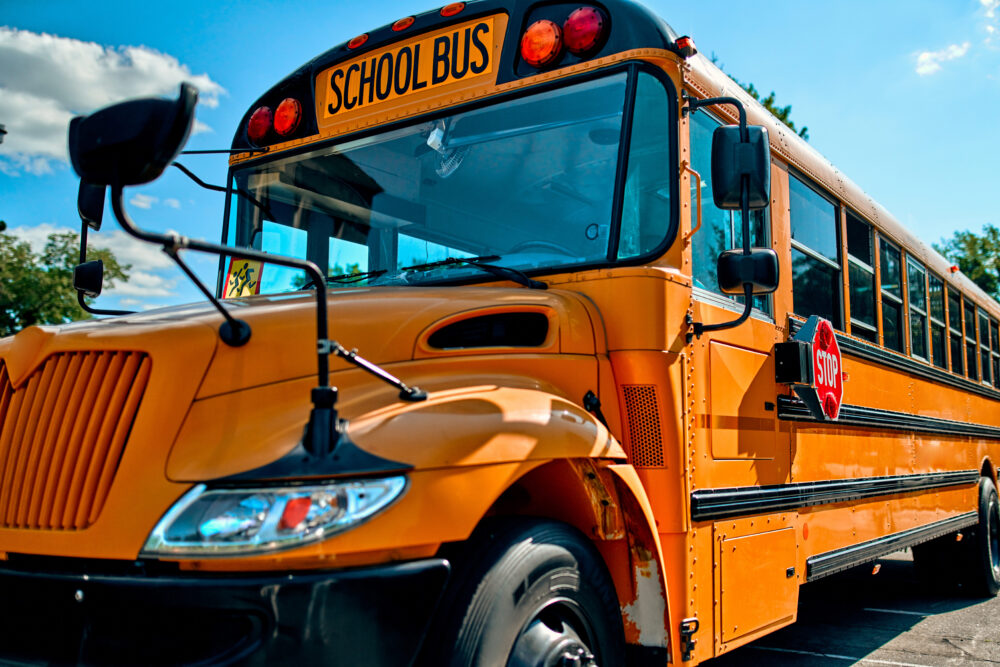 Cropped image of yellow school bus