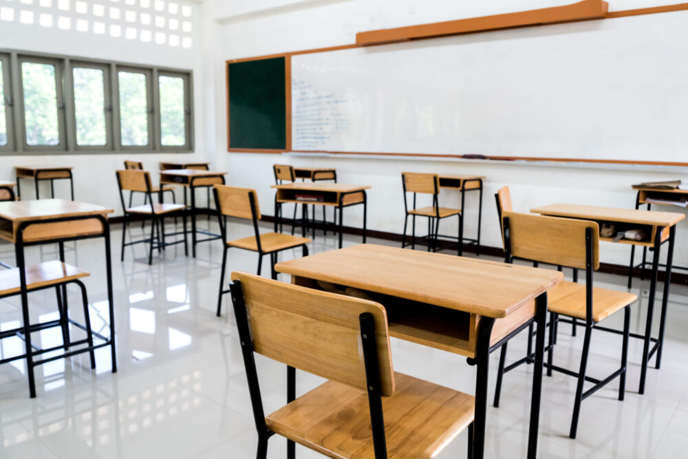 empty classroom with desk chairs