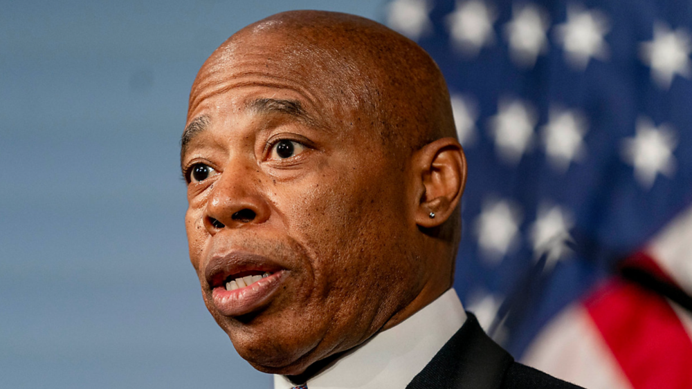 The Adams administration is seeking to cut migrant spending by 10%.