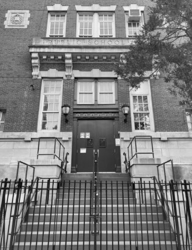 a public school where the entrance is at the top of a flight of stairs