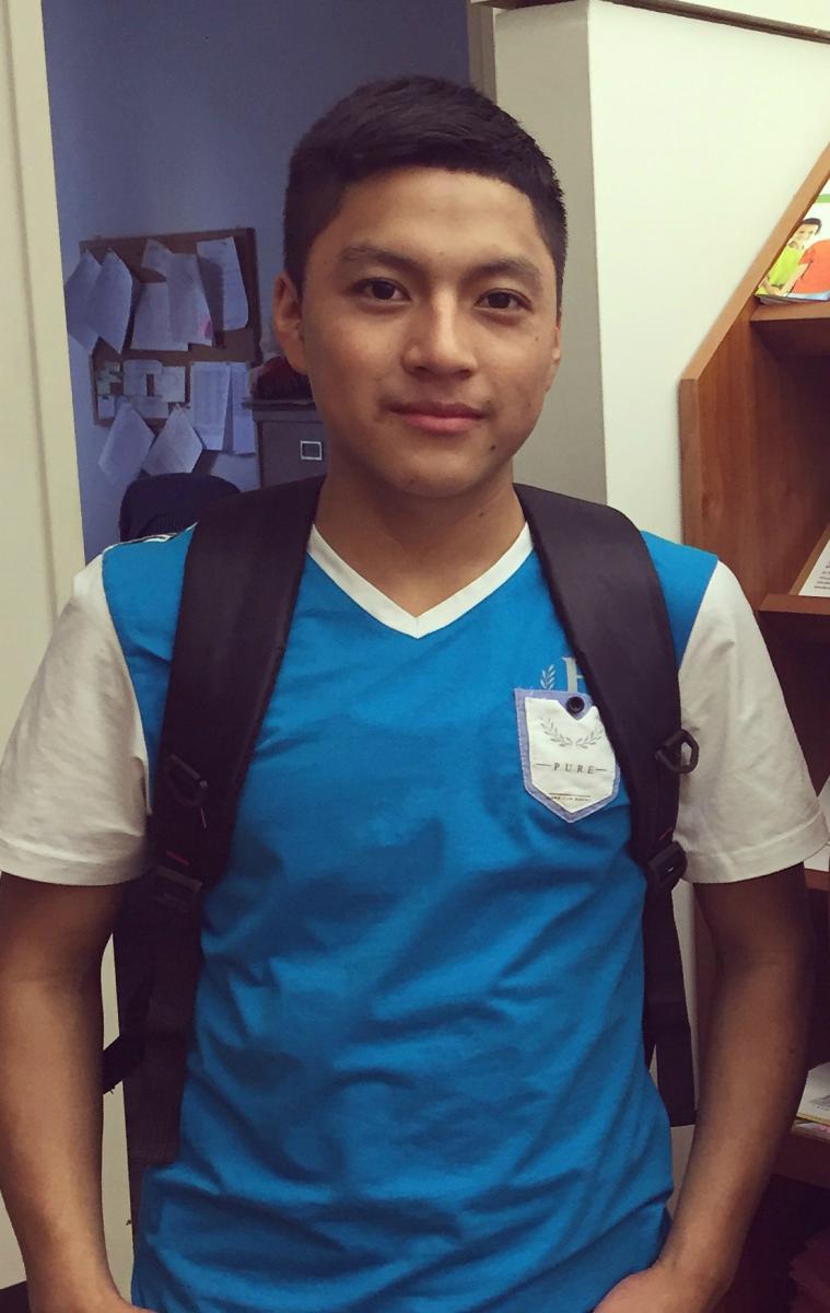 Carlos wearing school backpack