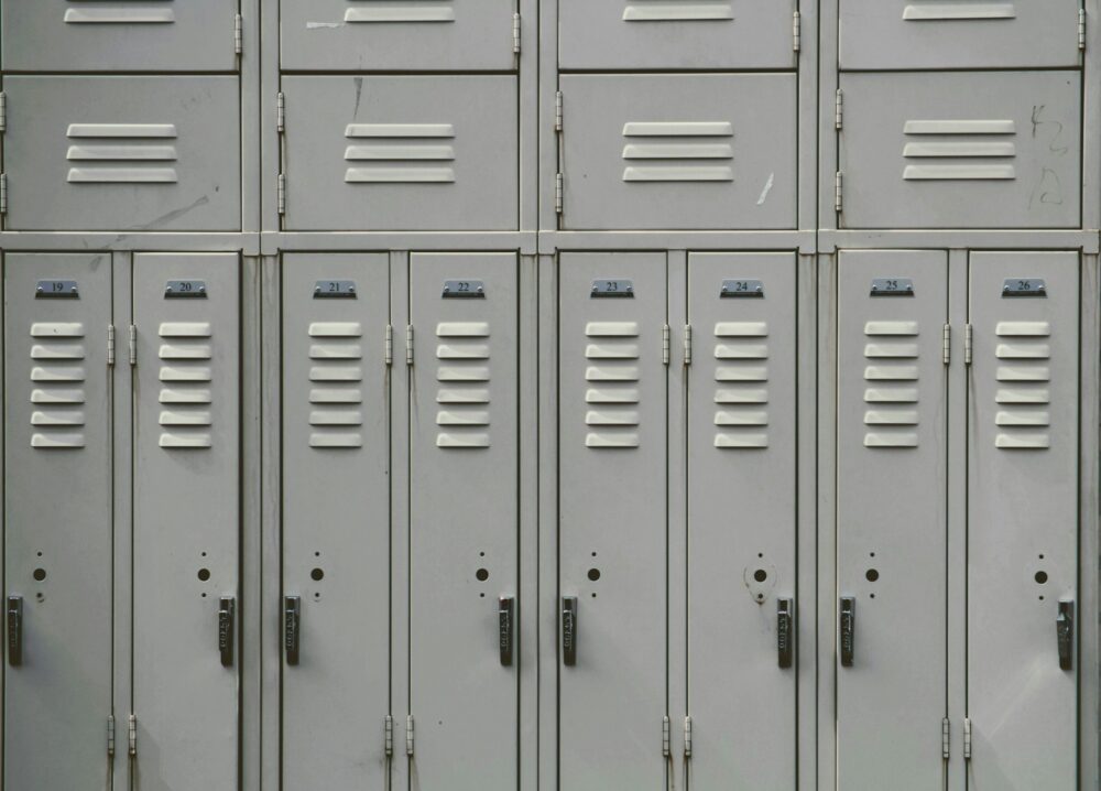 Gray lockers in a school hallway.