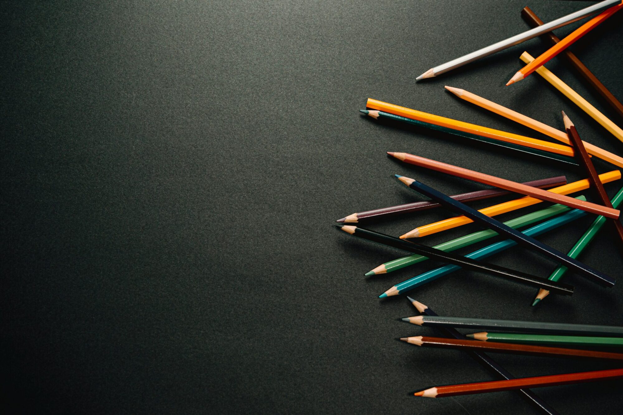 colored pencils on dark background