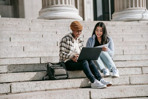 teenagers sit on steps