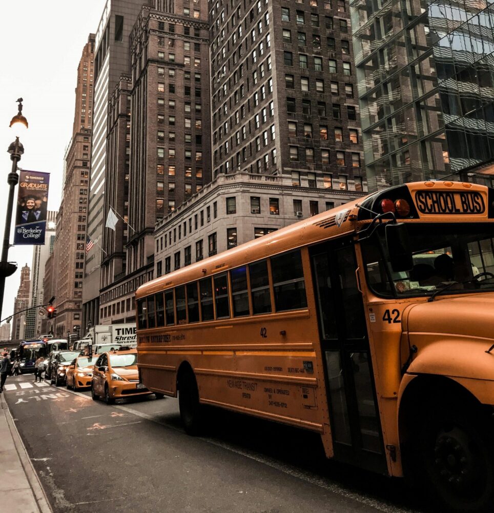 School bus on a busy Manhattan street.