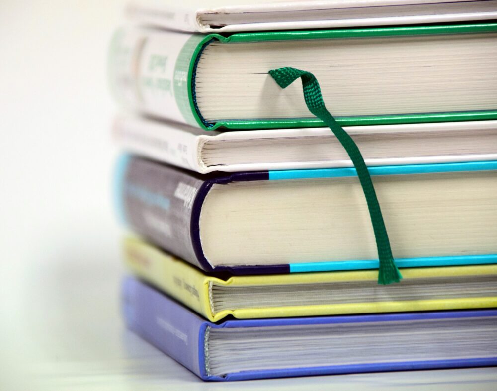 Stack of textbooks.